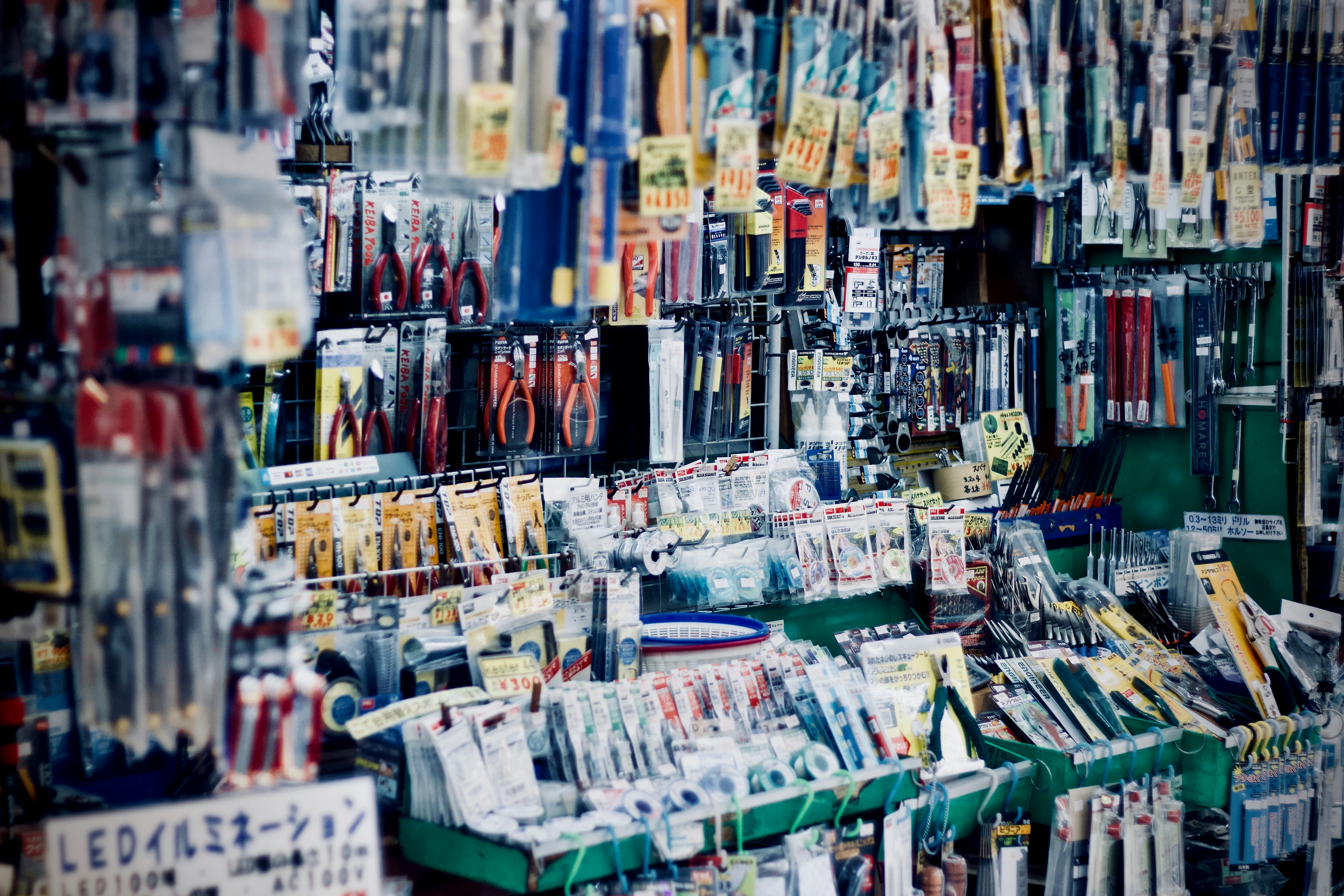 A dense wall of hand tools and small parts hanging on pegs